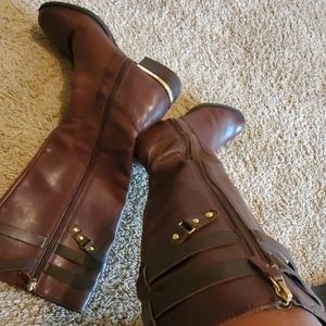 Gently worn brown leather boots.